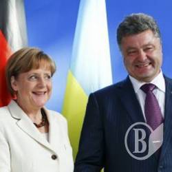 Порошенко при Меркель закликав Путіна припинити вогонь